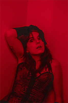 portrait of a crazy woman in red lighting